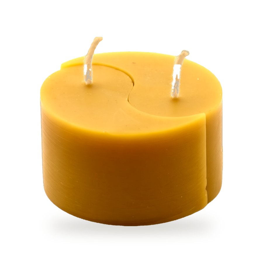 Ying Yang One Piece beeswax candle, white background studio photo