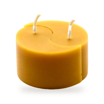 Ying Yang One Piece beeswax candle, white background studio photo