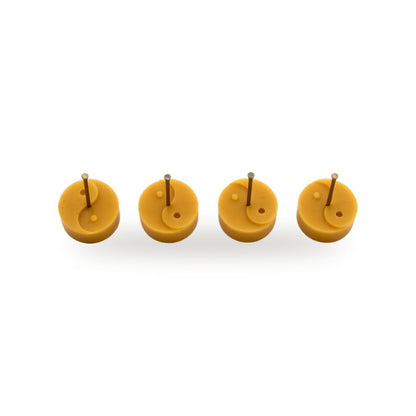 Ying Yang Tea Lights beeswax candle, white background studio photo