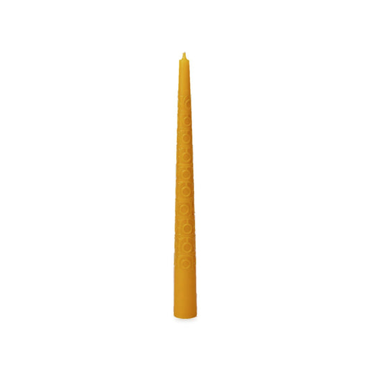 Vintage beeswax taper with a fine raised pattern on a white background